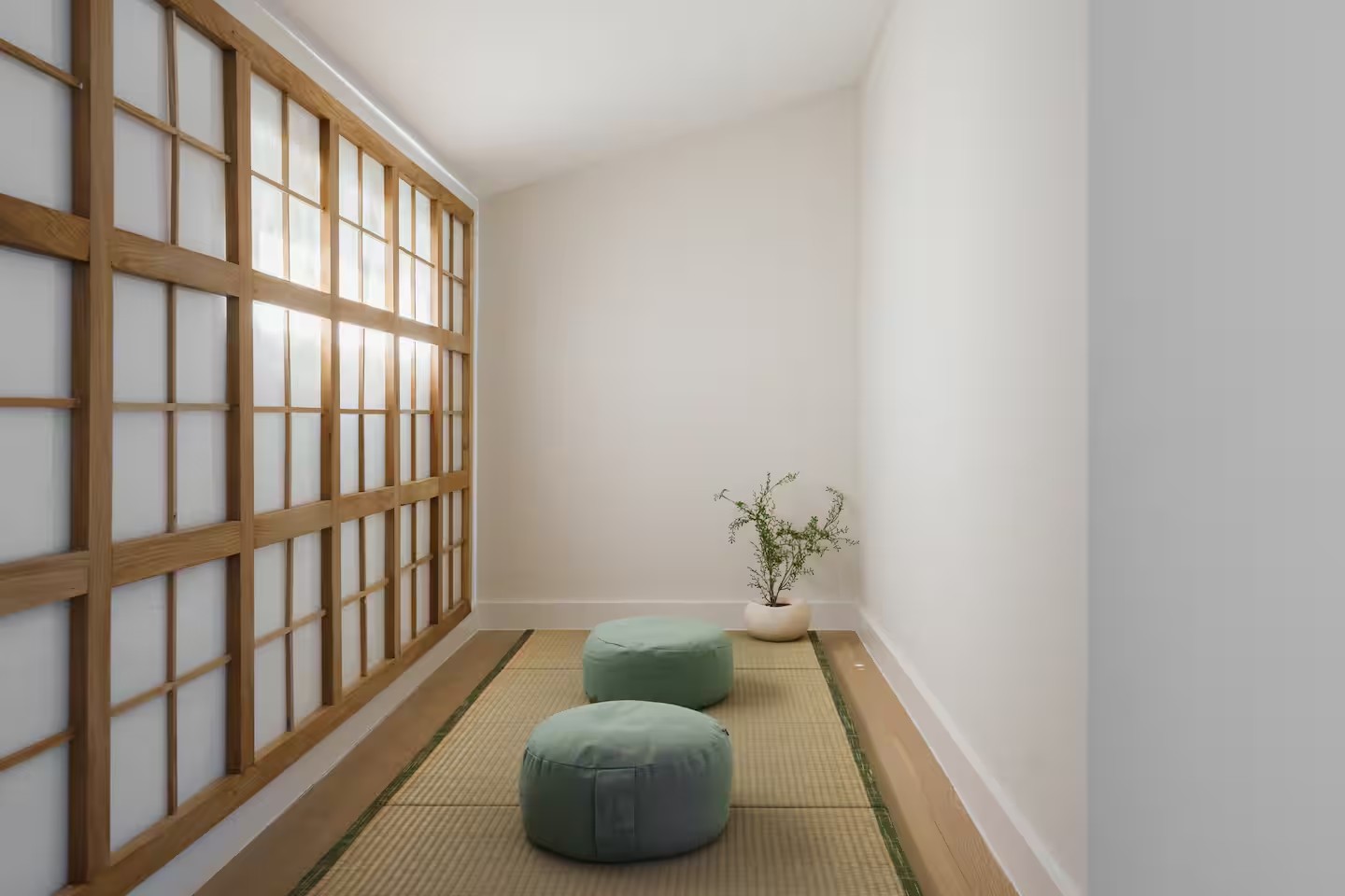 Meditation room with shoji walls for wellness retreat