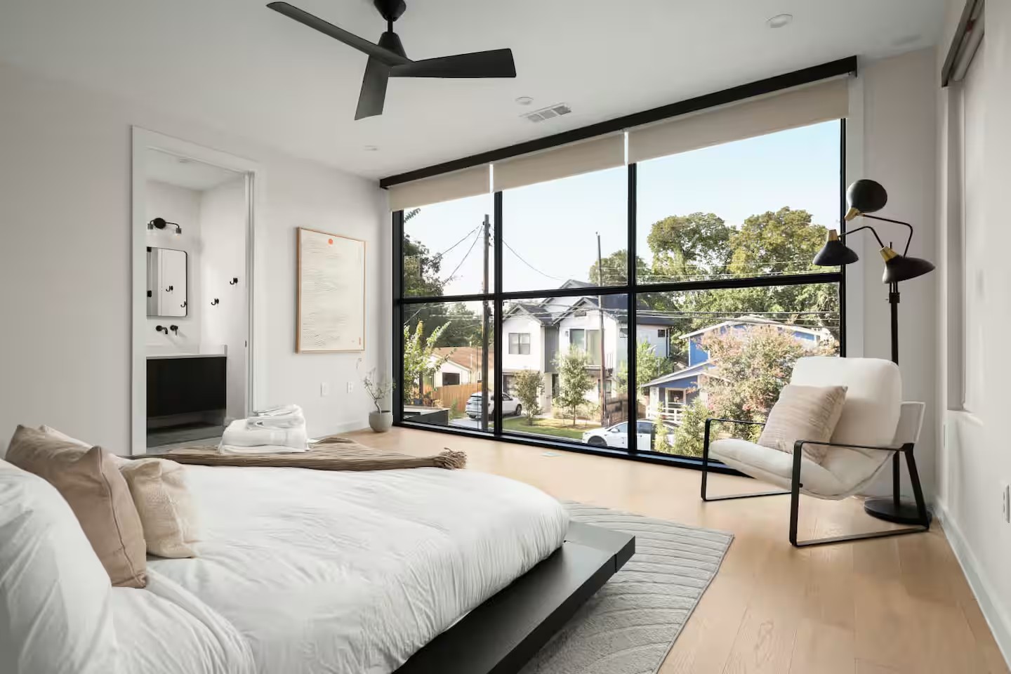 Primary bedroom suite with floor to ceiling glass windows